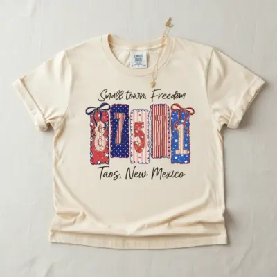 Ivory garment-dyed Comfort Colors t-shirt with 87571 Taos New Mexico zip code graphic printed on front chest