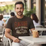 flagstaff-arizona-souvenir-shirt-vacation-travel-tee-comfort-mature-male-espresso.webp Espresso brown garment-dyed Comfort Colors t-shirt featuring Flagstaff Arizona souvenir destination city pride graphic worn by a man outdoors