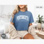 portsmouth-varsity-shirt-nh-hometown-pride-tee-comfort-colors-t-shirt-mature-female-blue-jean.webp portsmouth varsity shirt nh hometown pride tee comfort colors t shirt mature female blue jean